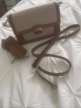 Kate Spade Voyage Canvas Medium Shoulder Bag, which features a beige canvas body